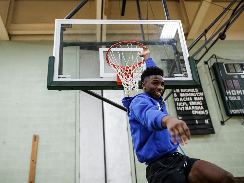 Detroit Pistons Hamidou Diallo dunks while playing one-on-one with kids attending the 'Hami Day' basketball camp at Flint Northwestern High School.