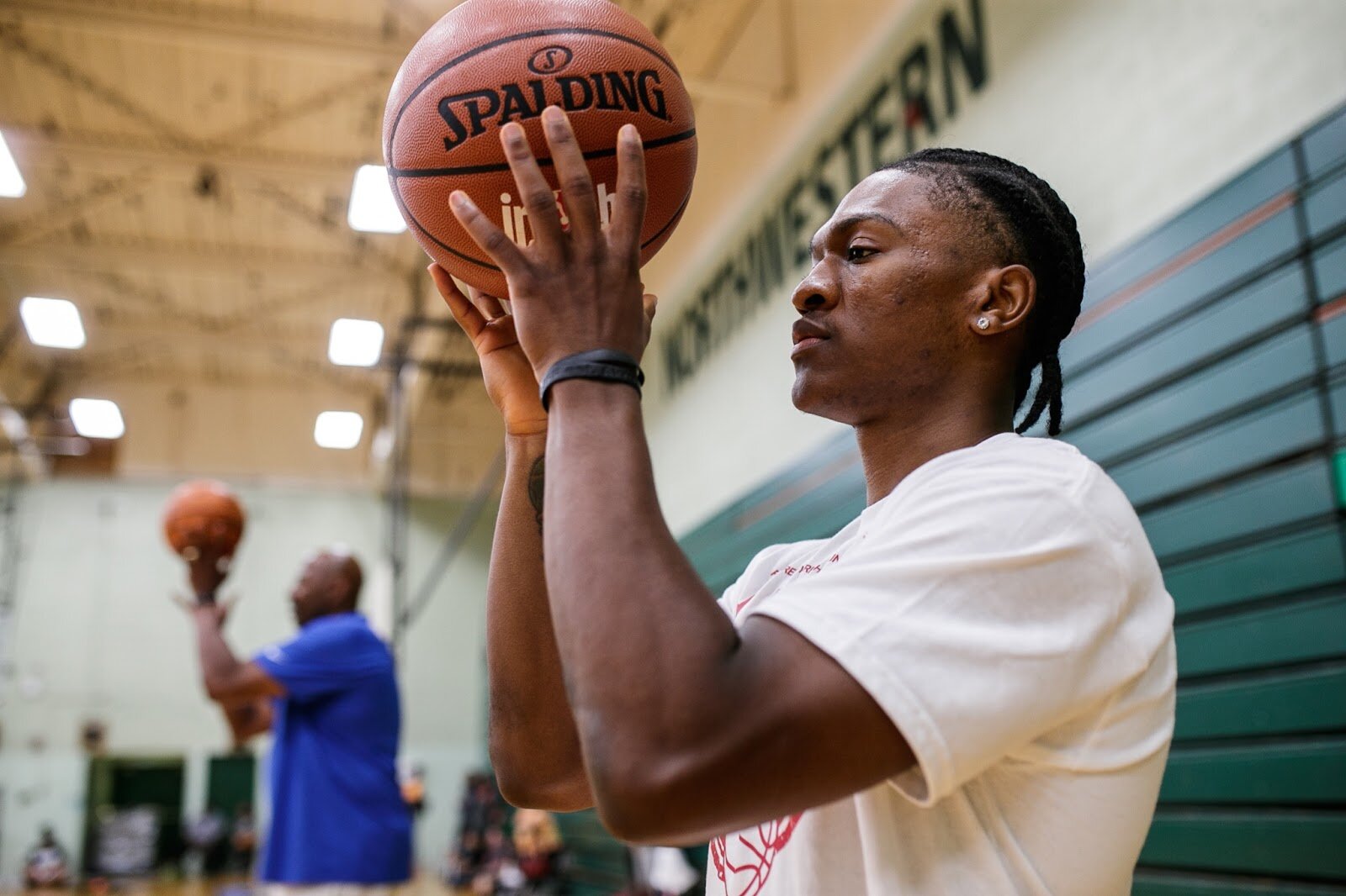 Starlin Hamilton, a free agent point guard, runs drills alongside Earl Cureton, with kids attending Hami Day Camp at Flint Northwestern High School in Flint on Friday, Aug. 27, 2022. (Jenifer Veloso | Flintside.com)

