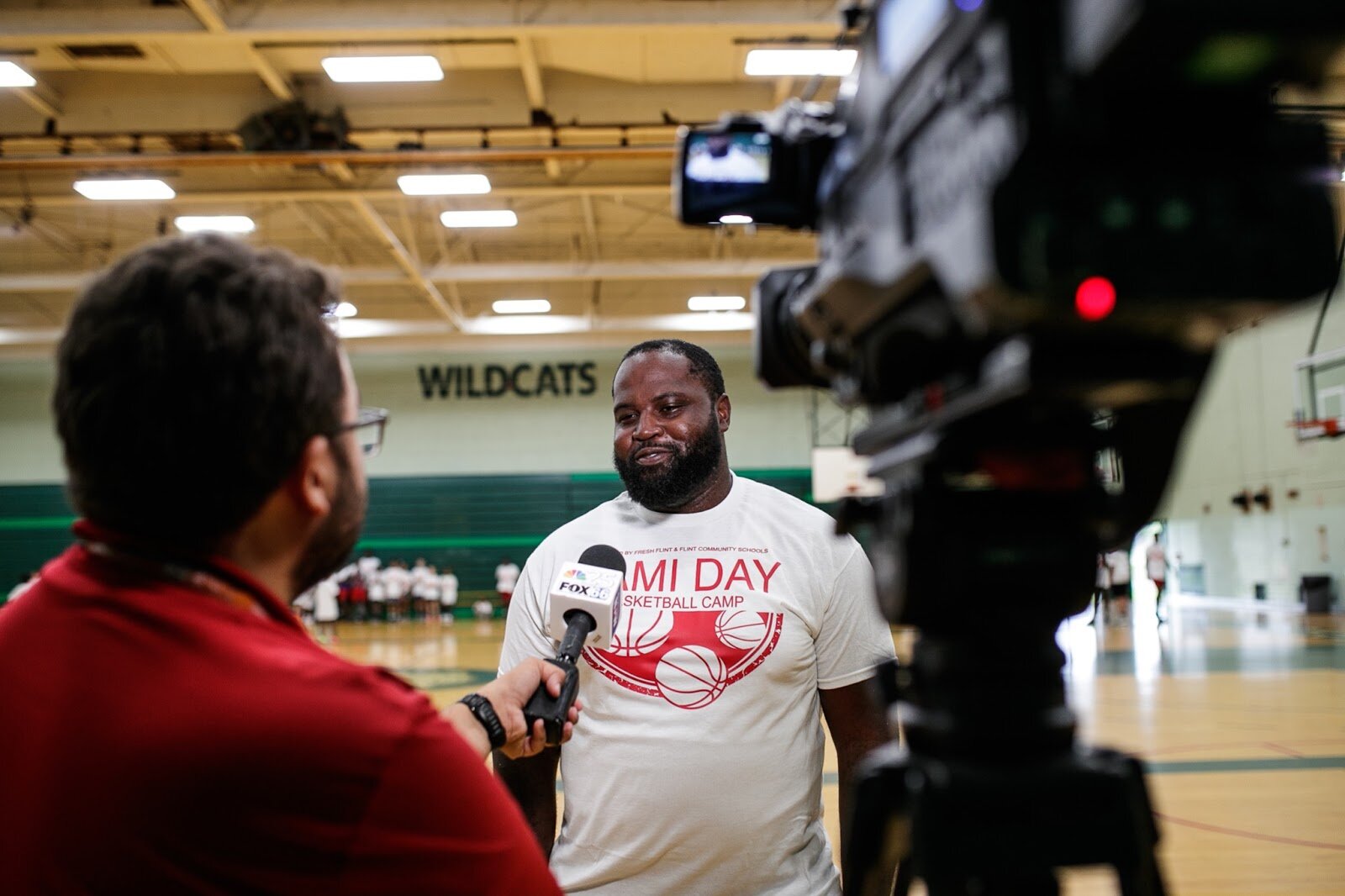 Kevin Mays, the owner of Flint United, talks to the press during Hami Day Camp at Flint Northwestern High School on Friday, Aug. 27, 2022. (Jenifer Veloso | Flintside.com)
