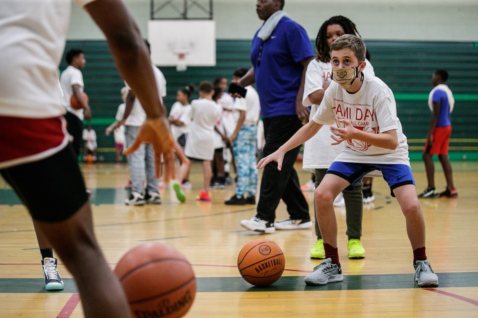 Oliver Hayes practices dribbling fundamentals during Hami Day Camp at Flint Northwestern High School on Friday, Aug. 27, 2022. (Jenifer Veloso | Flintside.com)
