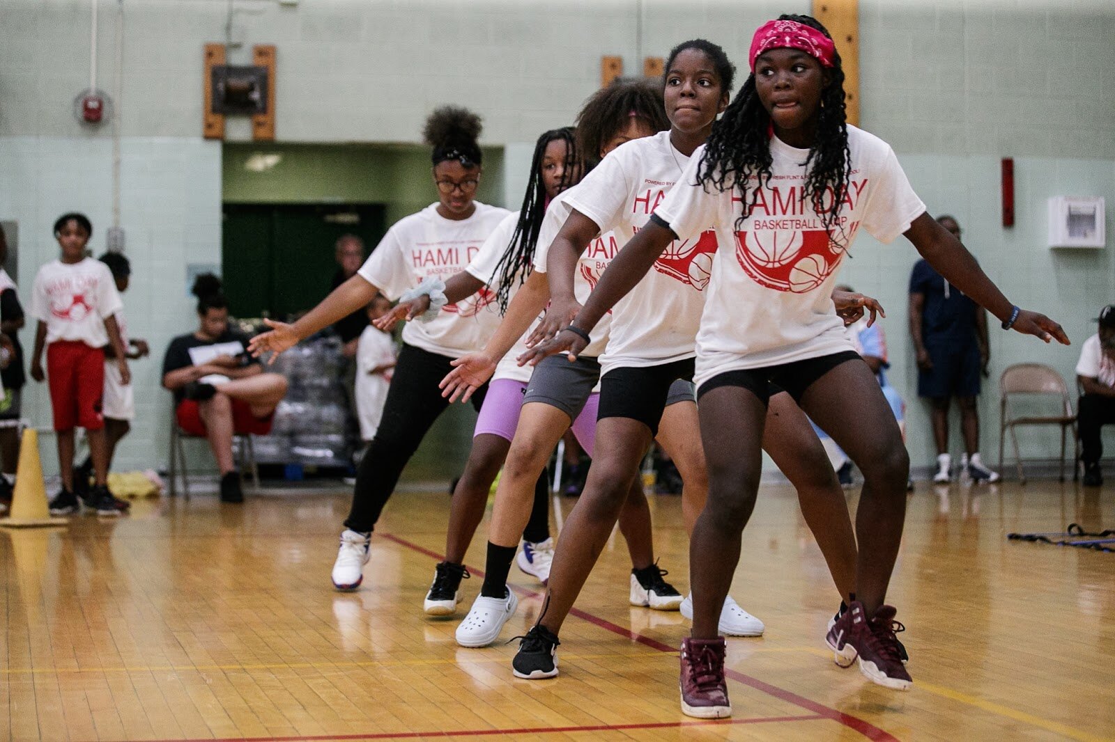 Attendants run footwork drills during Hami Day Camp at Flint Northwestern High School on Friday, Aug. 27, 2022. (Jenifer Veloso | Flintside.com)
