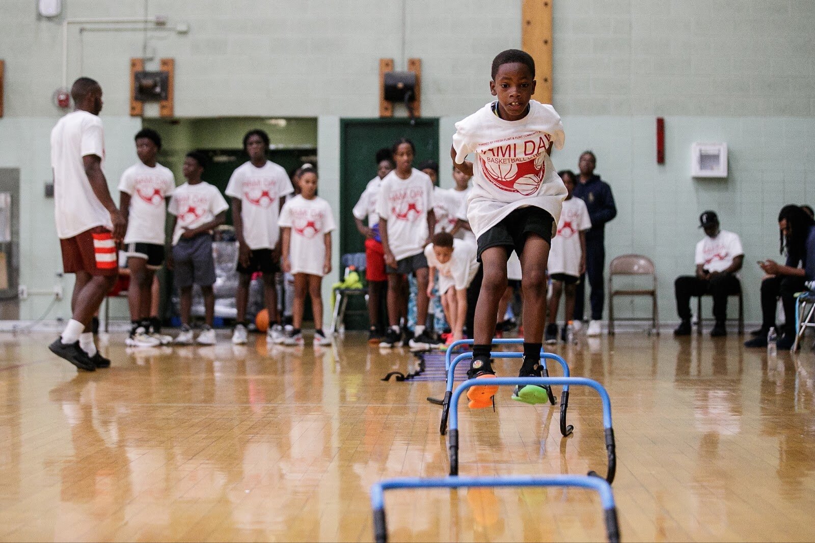 A Hami Day basketball camp attendant runs footwork drills during Hami Day Camp at Flint Northwestern High School on Friday, Aug. 27, 2022. (Jenifer Veloso | Flintside.com)
