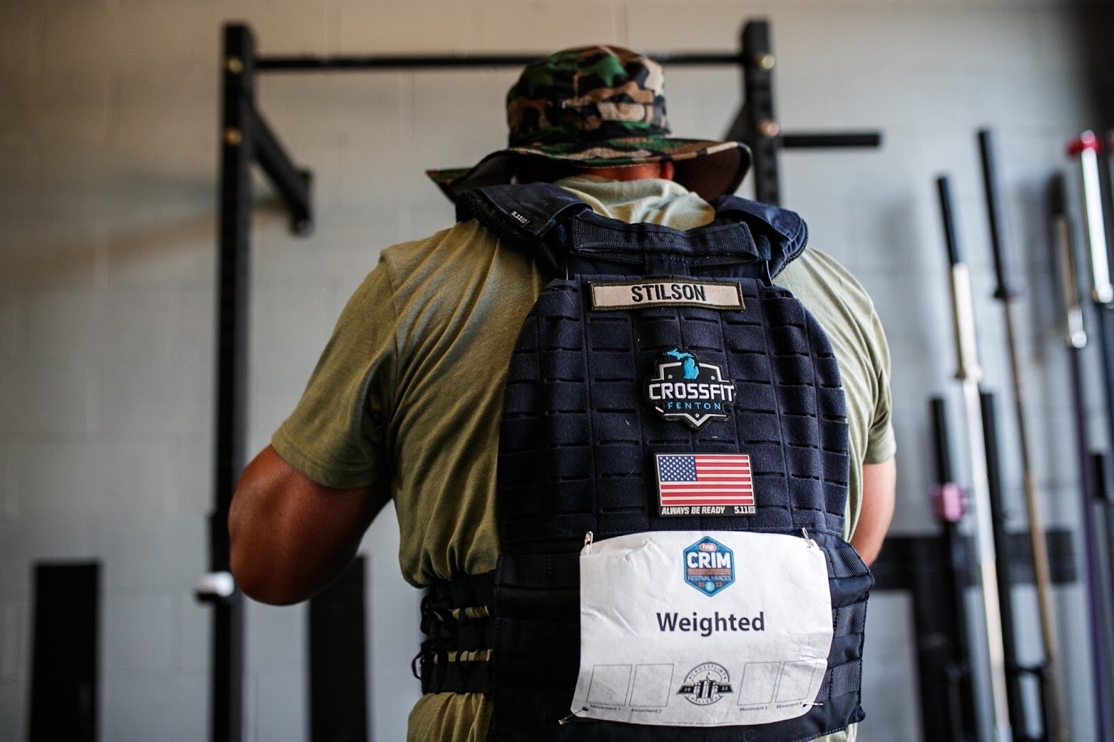 CrossFlint 5K Challenge competitor Donald Stilson prepares to do his first round of pulls-ups during the 45th annual Crim Festival of Races on Saturday, Aug. 27, 2022 in downtown Flint. (Jenifer Veloso | Flintside.com)
