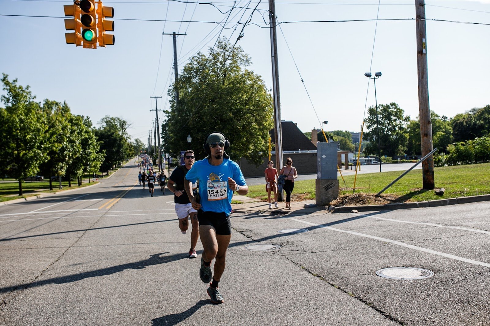 Hassan Almahdi races towards Sal's Gym on University Avenue for the CrossFlint 5K Challenge during the 45th annual Crim Festival of Races on Saturday, Aug. 27, 2022 in downtown Flint. (Jenifer Veloso | Flintside.com)
