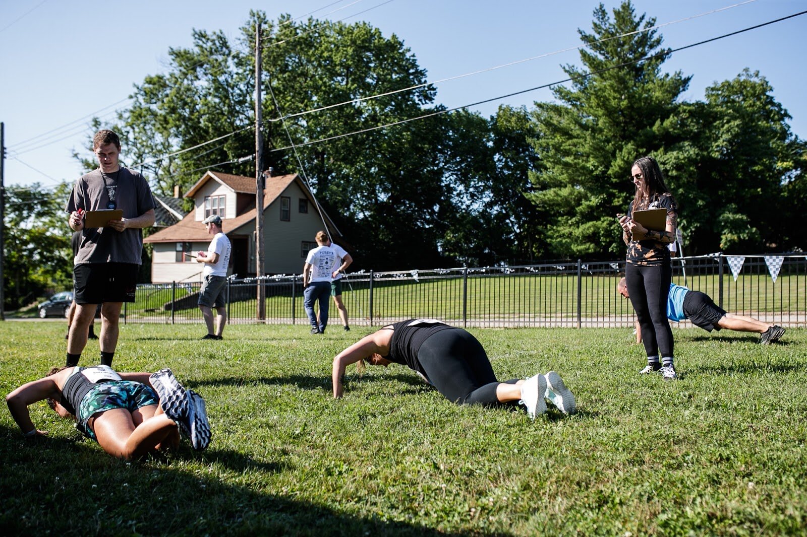 Judges observe and watch the time for the Body Weight Challenge participants for the CrossFlint 5K Challenge during the 45th annual Crim Festival of Races on Saturday, Aug. 27, 2022 in downtown Flint. (Jenifer Veloso | Flintside.com)
