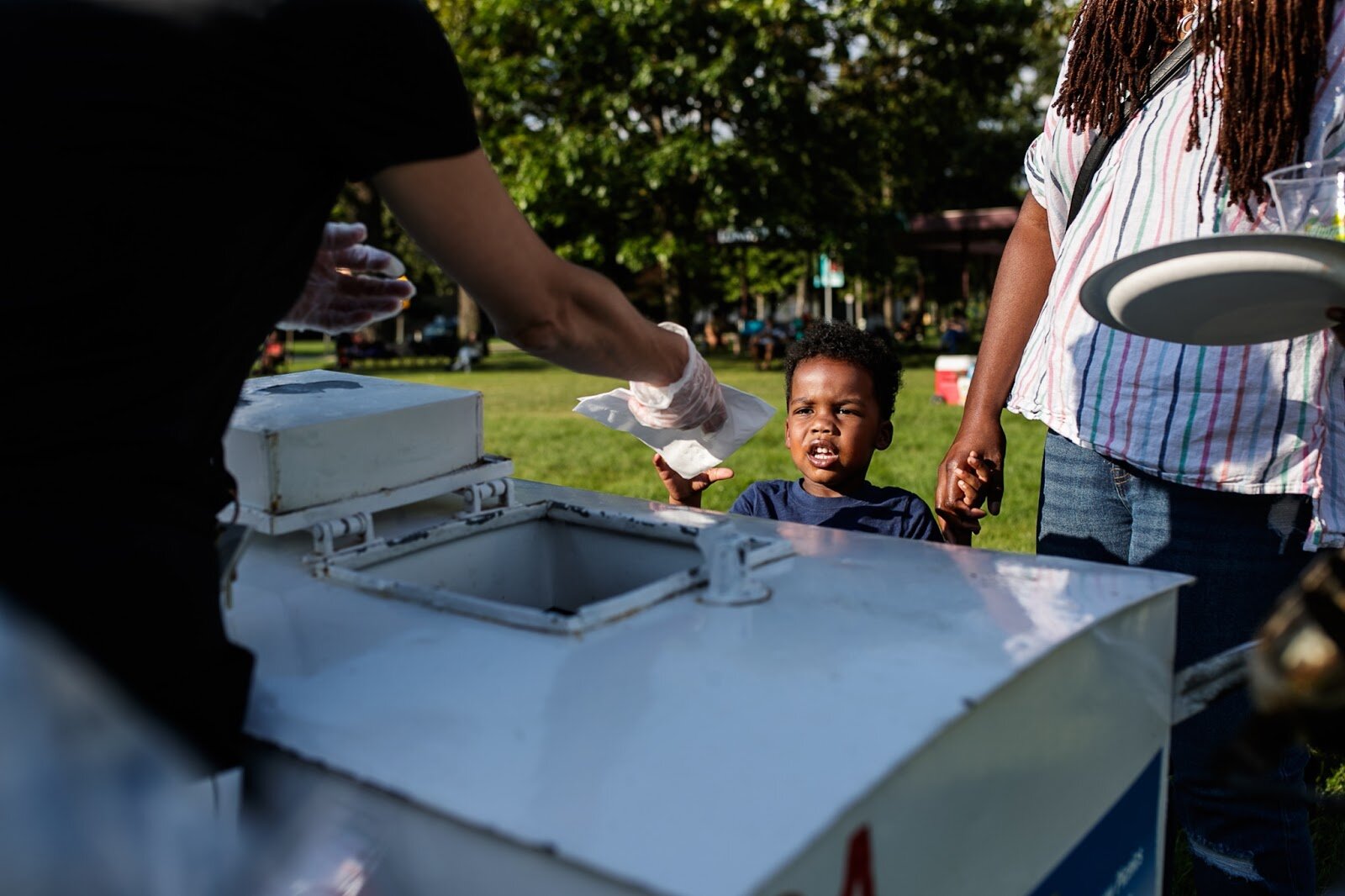 Free ice cream is given to a child during Family Night at 'Late Night at the FIA' on Friday, Aug. 19, 2022. (Jenifer Veloso | Flintside.com)
