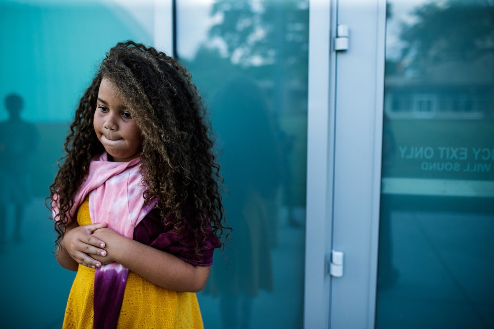 A child waits in line to color a coaster during Family Night at 'Late Night at the FIA' on Friday, Aug. 19, 2022. (Jenifer Veloso | Flintside.com)
