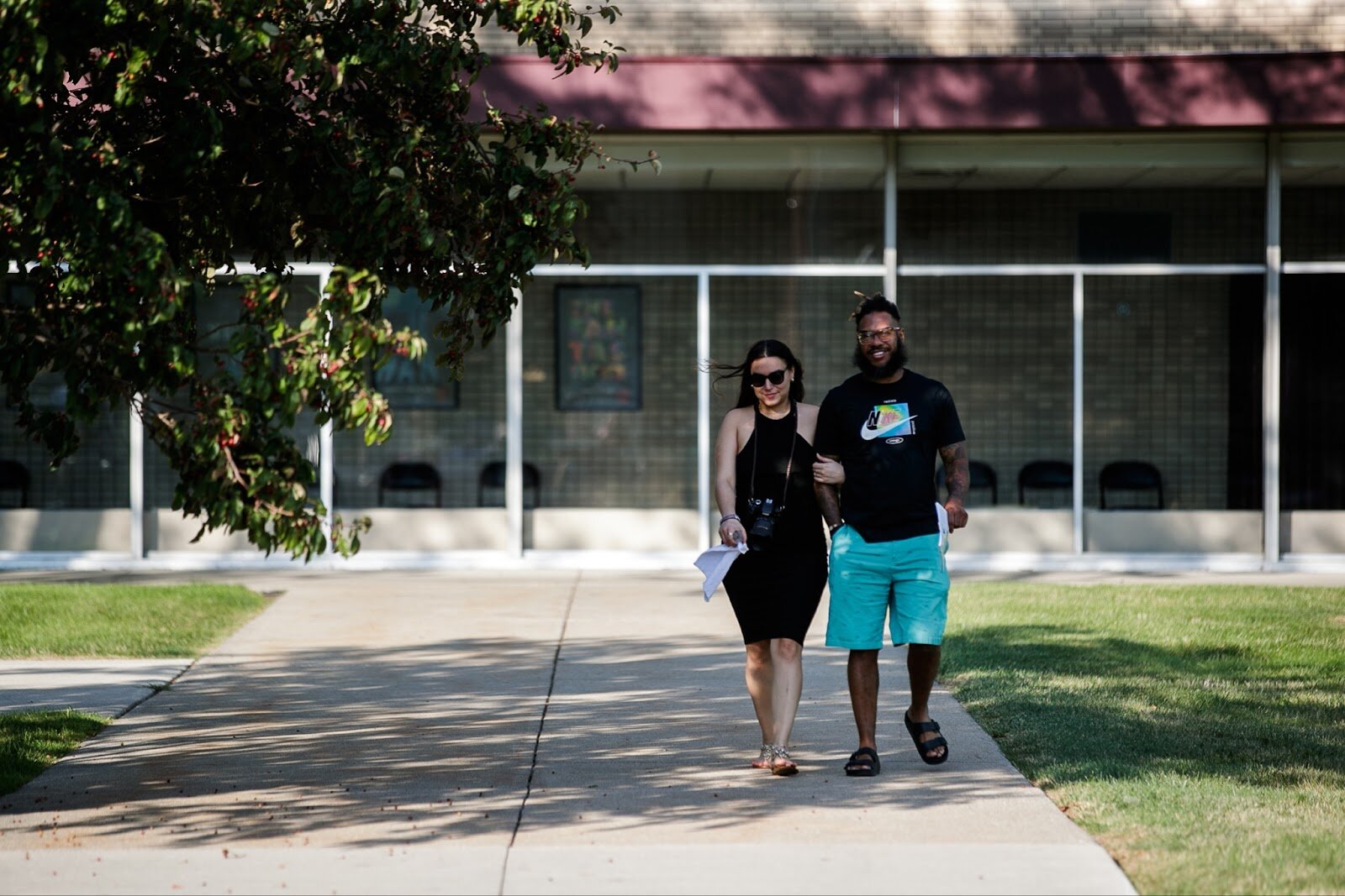 A couple walks down to the lawn to enjoy live music during Family Night at 'Late Night at the FIA' on Friday, Aug. 19, 2022. (Jenifer Veloso | Flintside.com)
