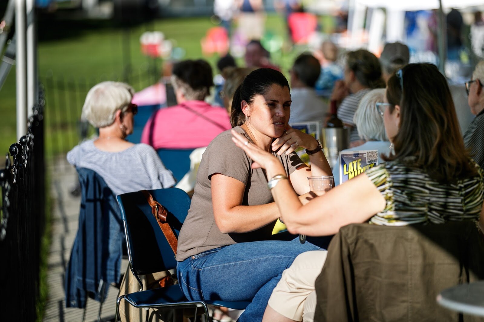 Guests enjoy drinks outside of the Palette Cafe Patio during Family Night at 'Late Night at the FIA' on Friday, Aug. 19, 2022. (Jenifer Veloso | Flintside.com)
