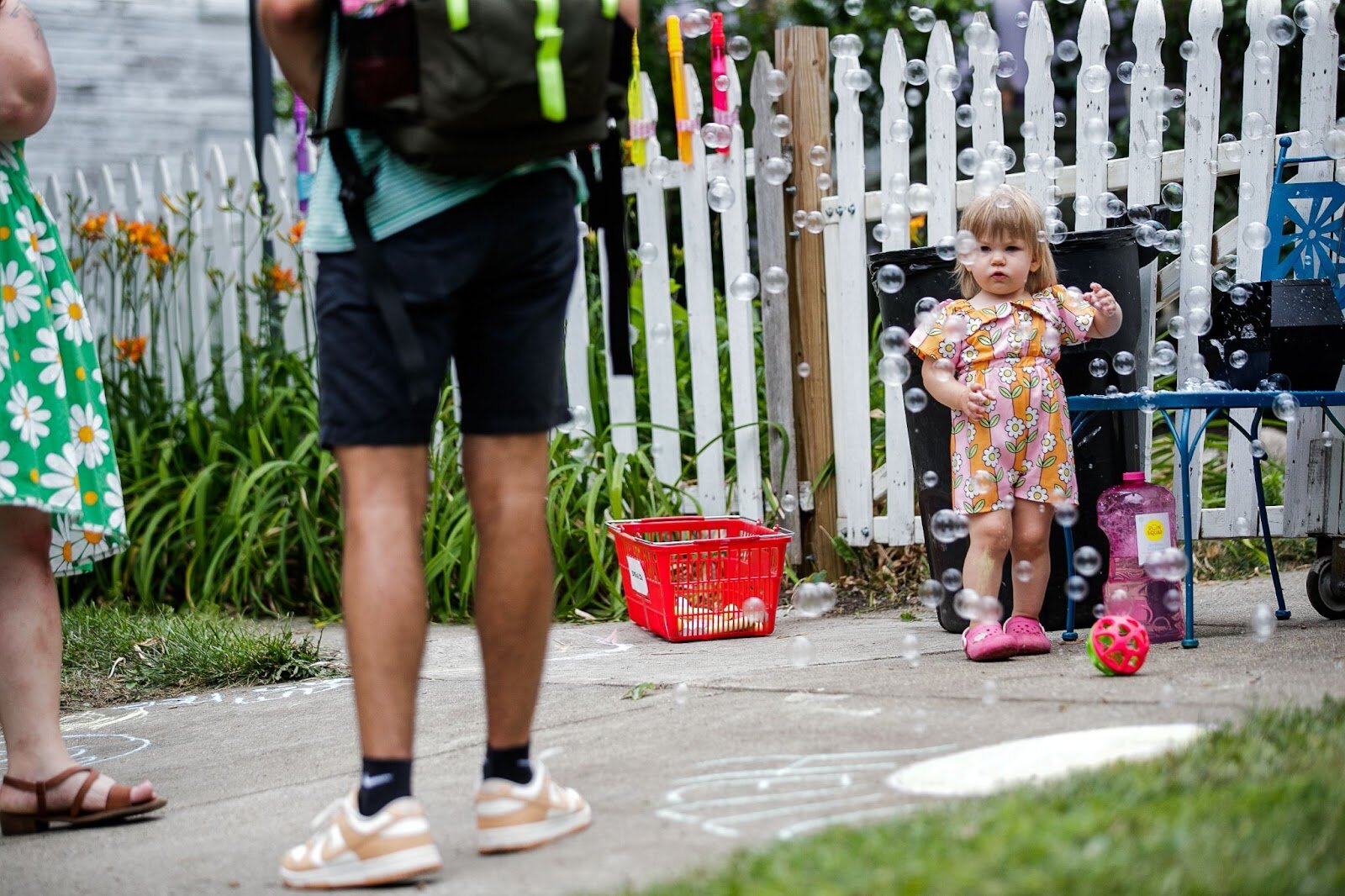 Bubbles, games, and chalk are provided for kids during Porch Fest on Friday, July 15, 2022. (Jenifer Veloso | Flintside)