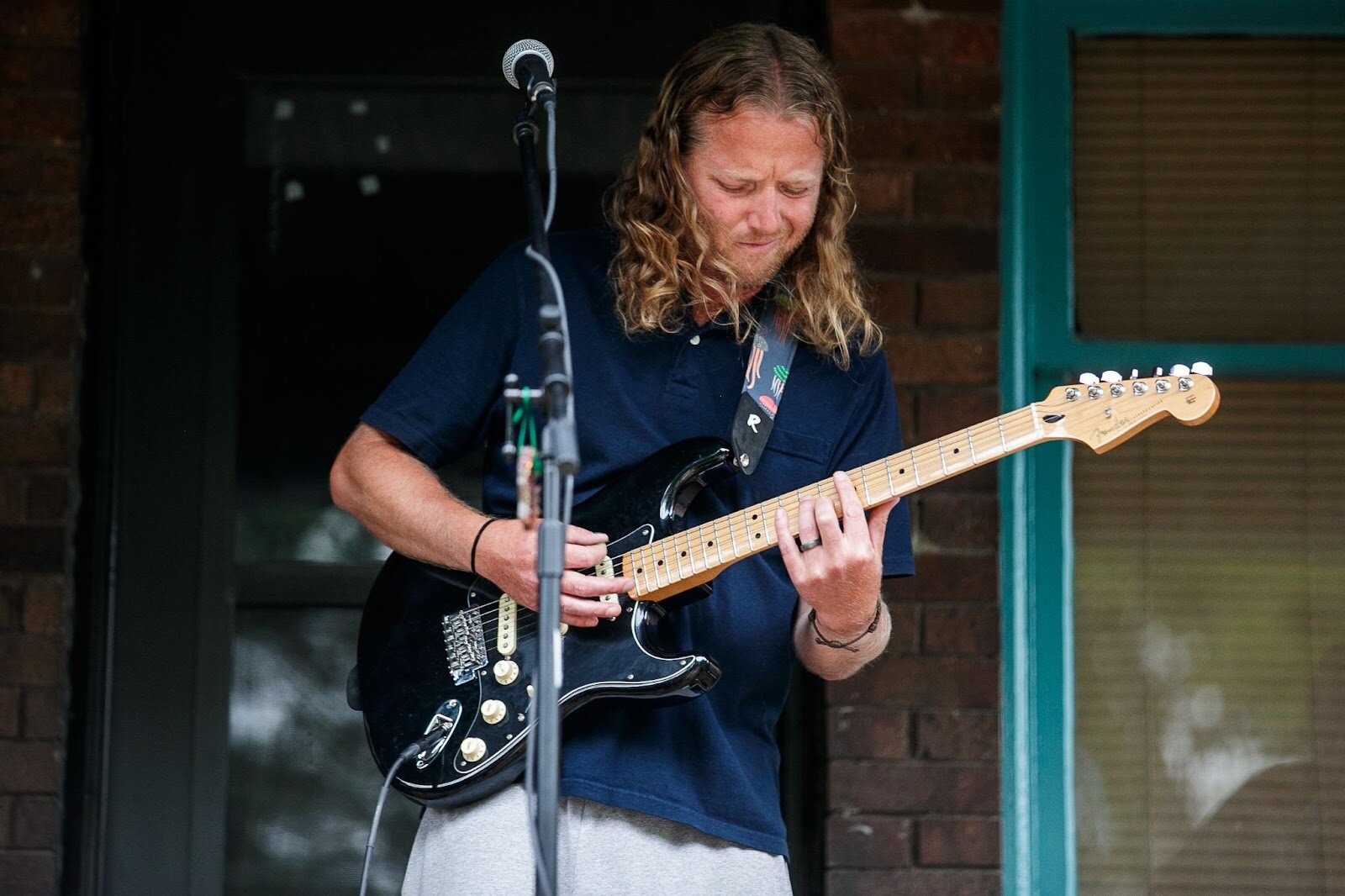 Live Music flows from the porches of Carriage Town during Porch Fest on Friday, July 15, 2022. (Jenifer Veloso | Flintside)