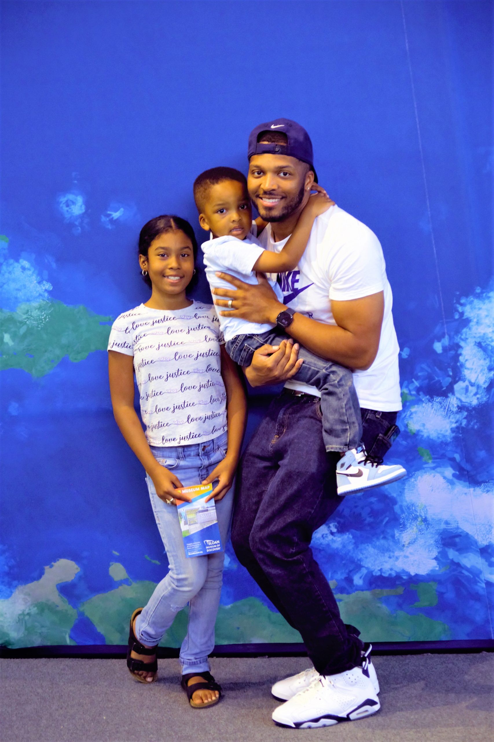 Jordan Ewell of Flint, pictured with his son and niece at Sloan's opening day.