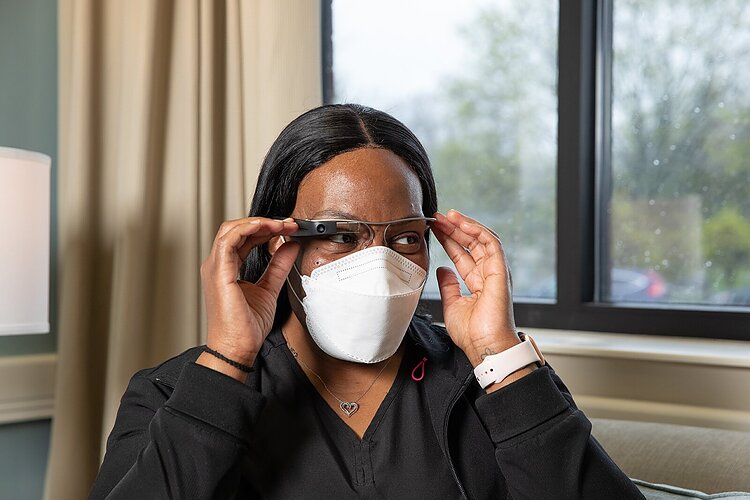 Dee Meux demonstrates smart glasses.
