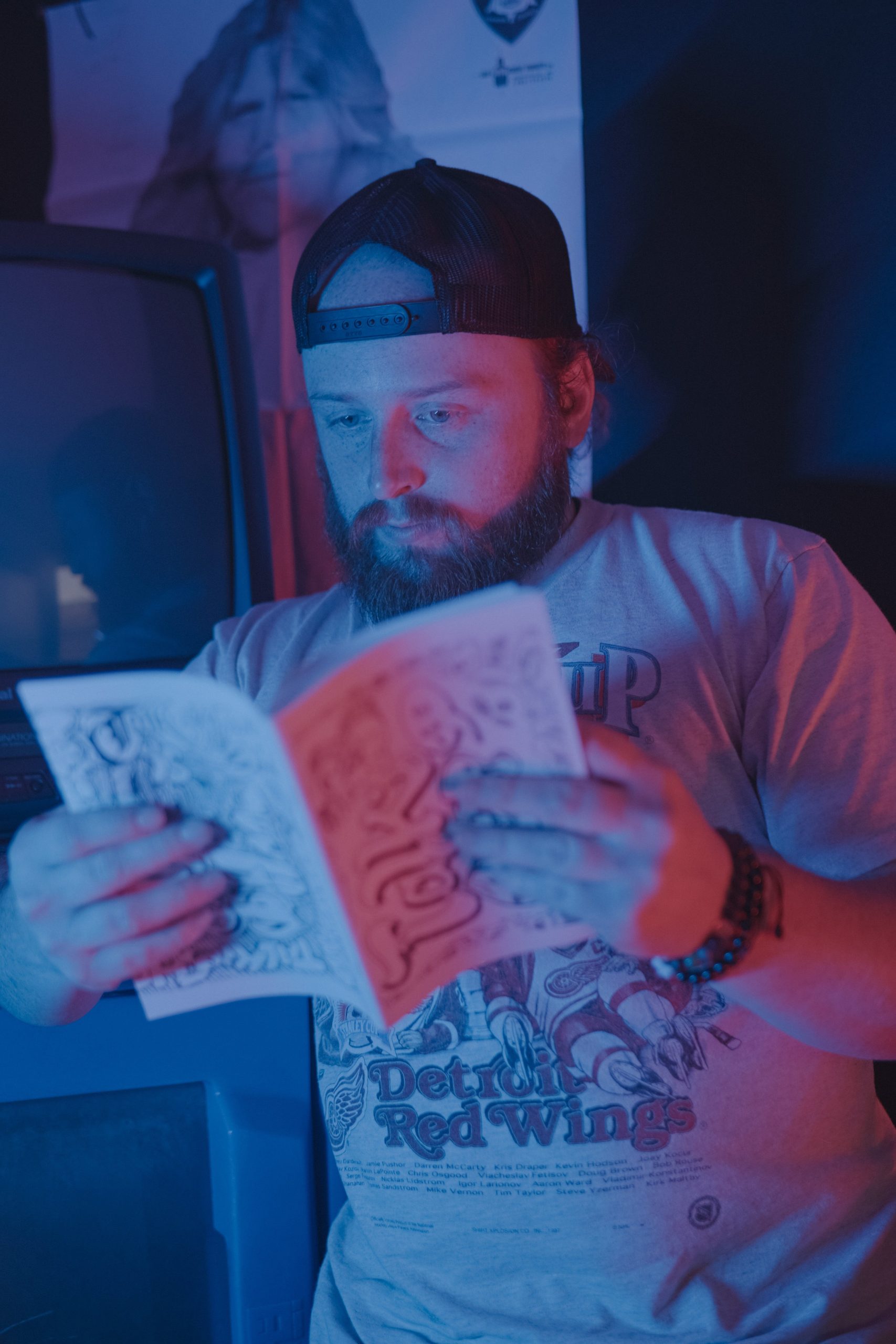 Ricketts reading his photography book titled 'Talk Is Cheap.'