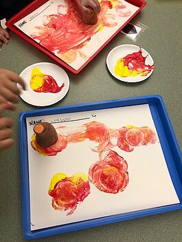 Students make sweet potato stamps in a TCAPS SNAP-Ed program.