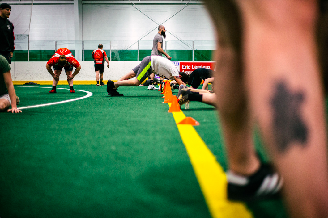 The team warms up during practice on the indoor soccer field inside Iceland Arena.