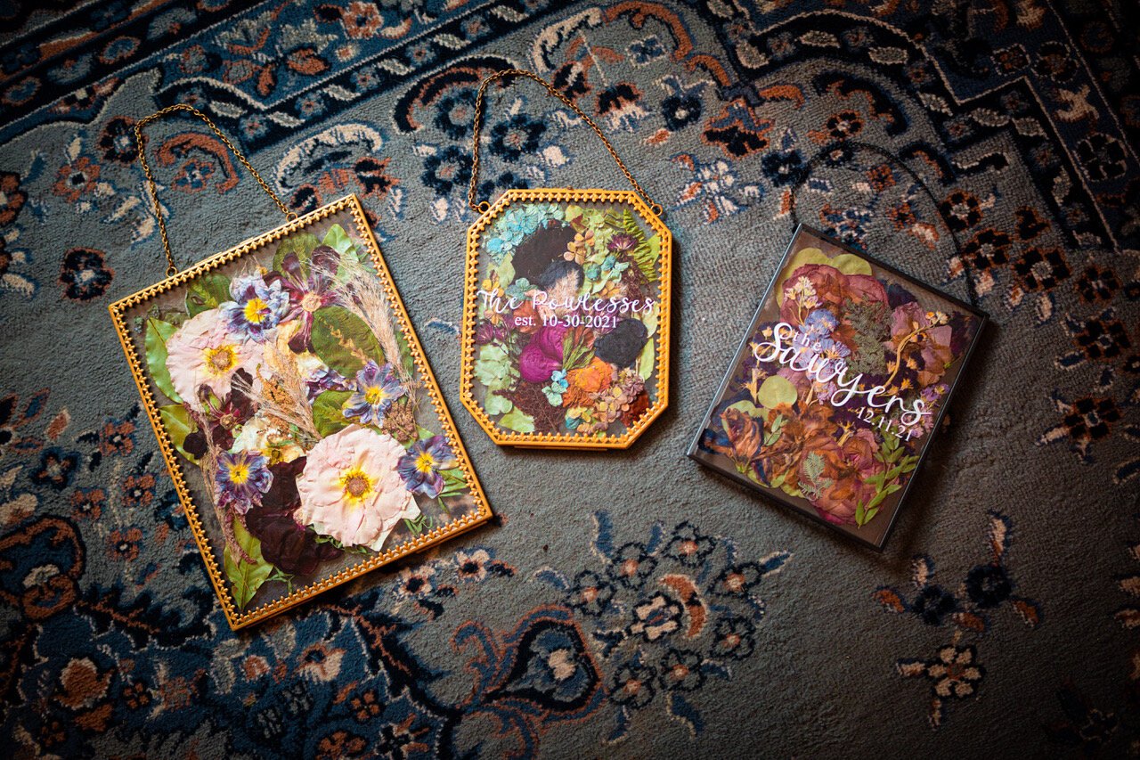 Several unique custom-made pressed flowers from Sincerely, Sage Jo's Etsy shop. 