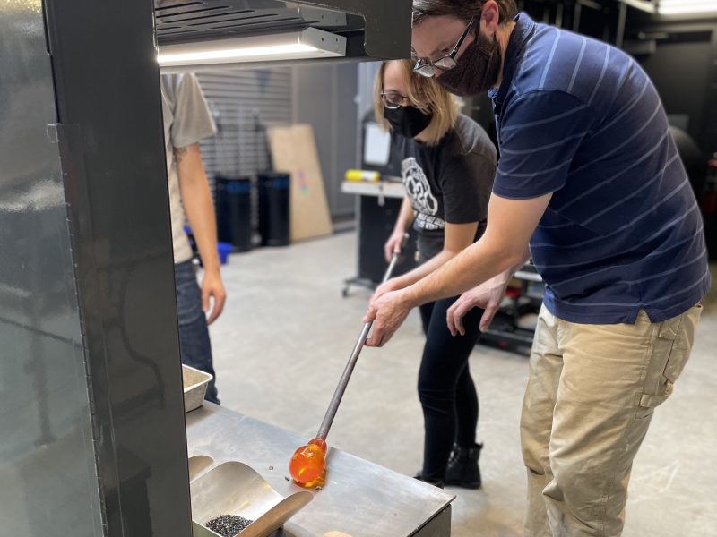 “The instructors are great, they walk you through everything to make sure you do it safely.” - Josie Anderson, UM-Flint student, pictured here working with FIA glass programs manager Brent Swanson.