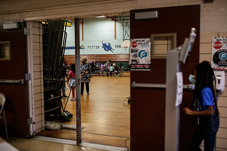 Children participate in a Mott-supported YouthQuest after-school program inside Potter Elementary's gymnasium.