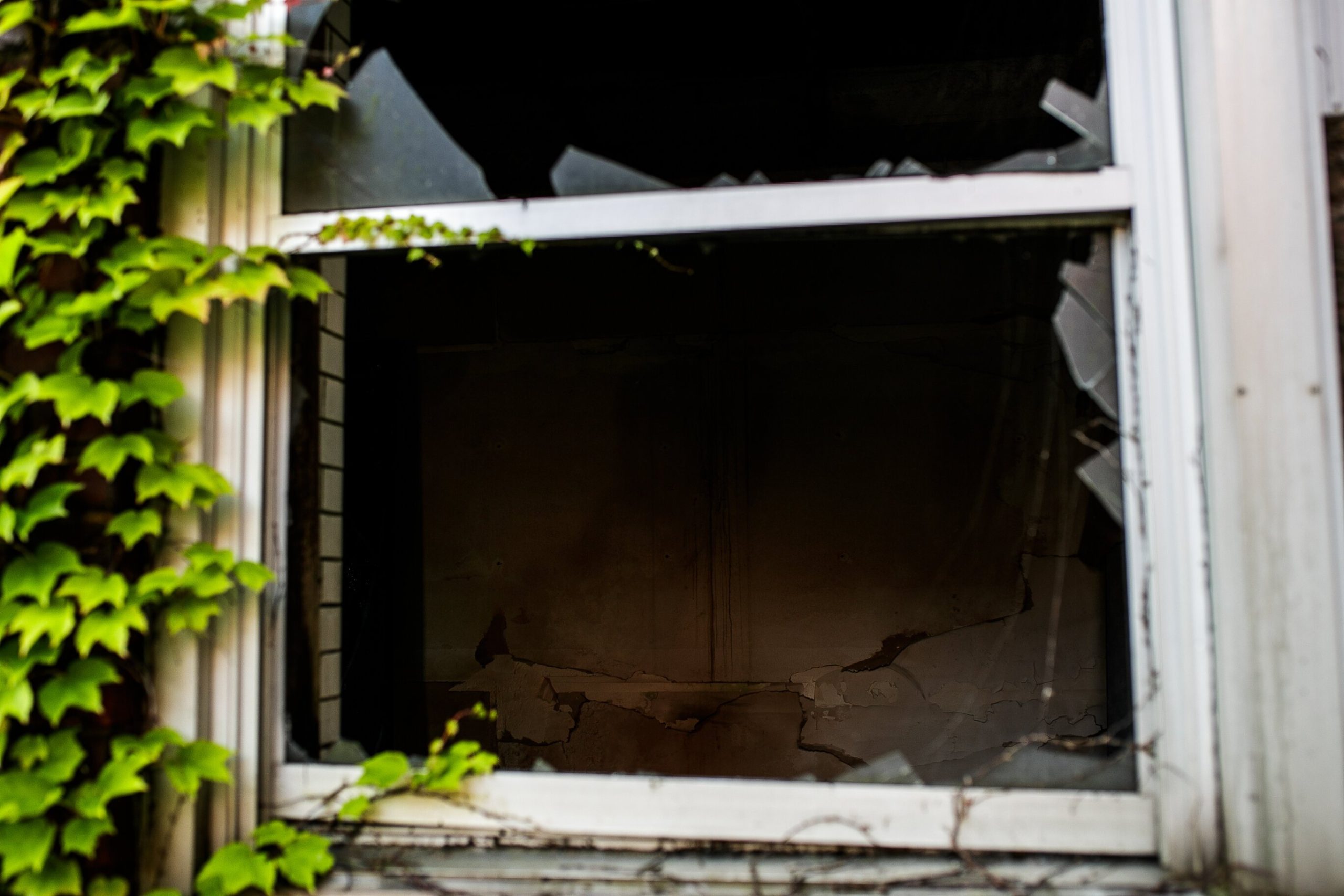 A broken window shows the interior of a former classroom inside Whitter Junior Highschool on September 15, 2021.