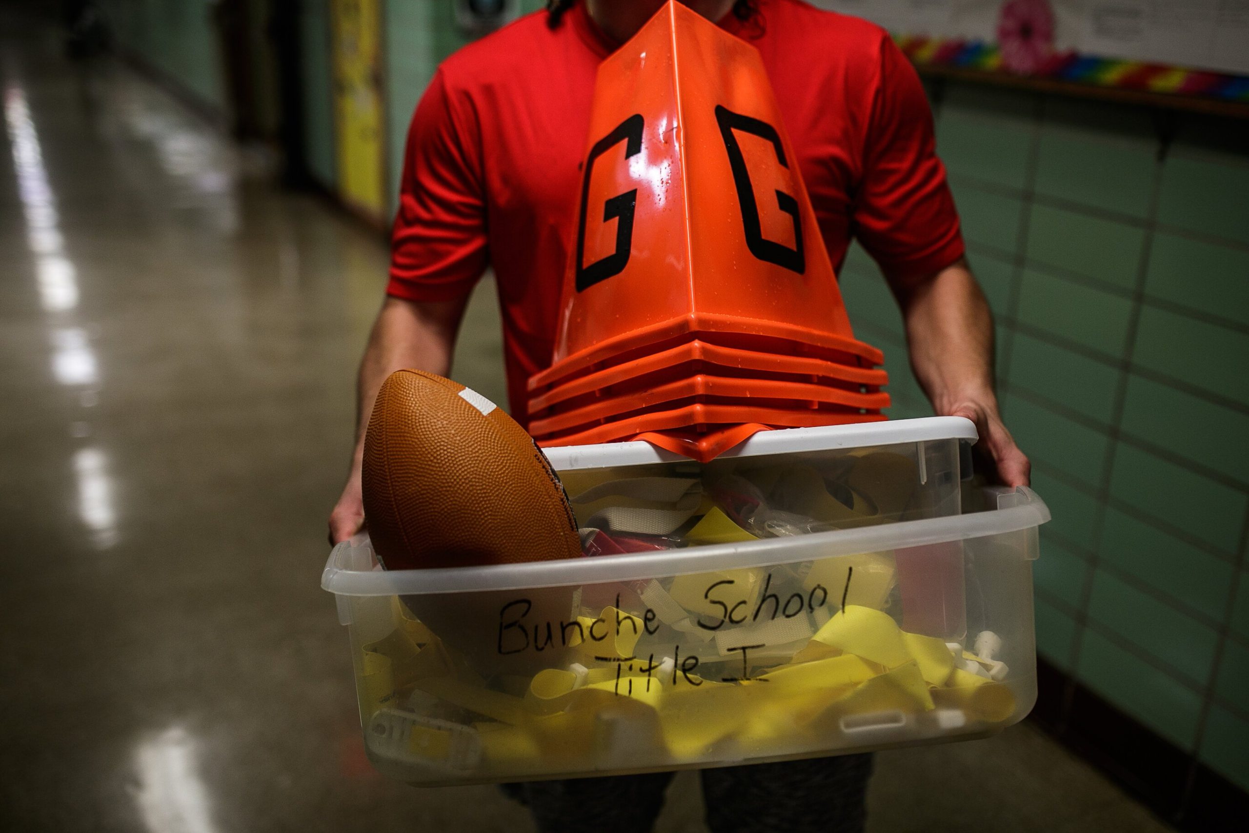 Jared Badour, Sports and Nutrition Coordinator for the Crim Foundation, coaches afterschool football for Crim Sports inside of Pierce Elementary.