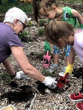 Children in the Child and Family Charities Family Growth Center's community garden.