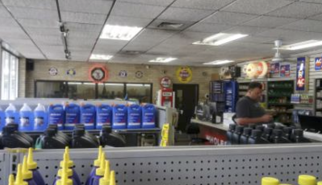 A customer shops inside Brown & Sons Auto Parts.