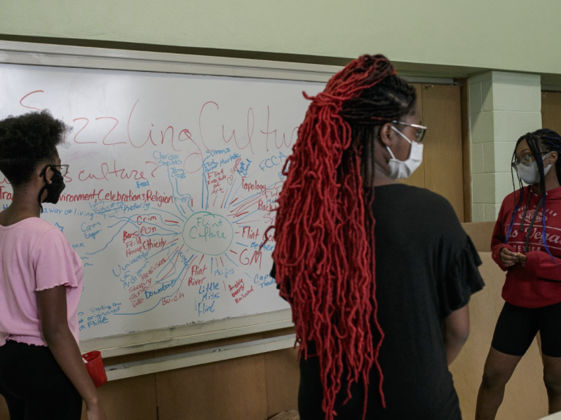 (Pictured left to right) Precious Manns, 14, Ericle Foster, 14, and Charity Manns, 15, discuss what is the definition of culture and what is Flint's culture.