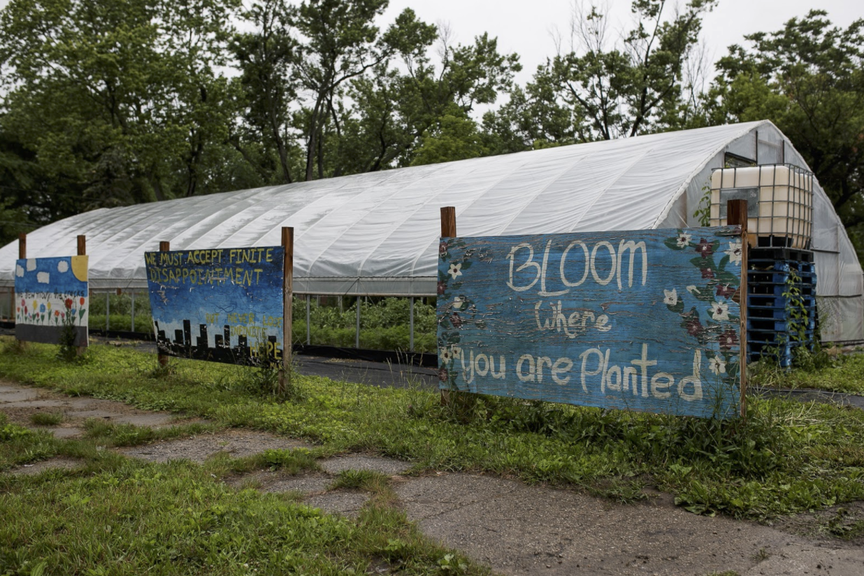 Local artists’ works are displayed outside of the hoop houses at Asbury Farms in the Eastside Franklin Park neighborhood.