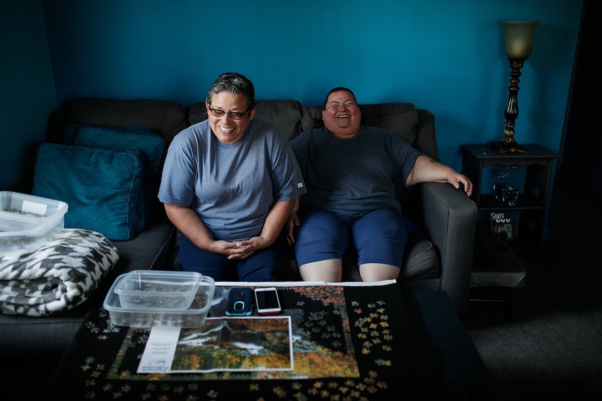 Vanilla Amaya and Billy Evaristo share a laugh in Evaristo's home.