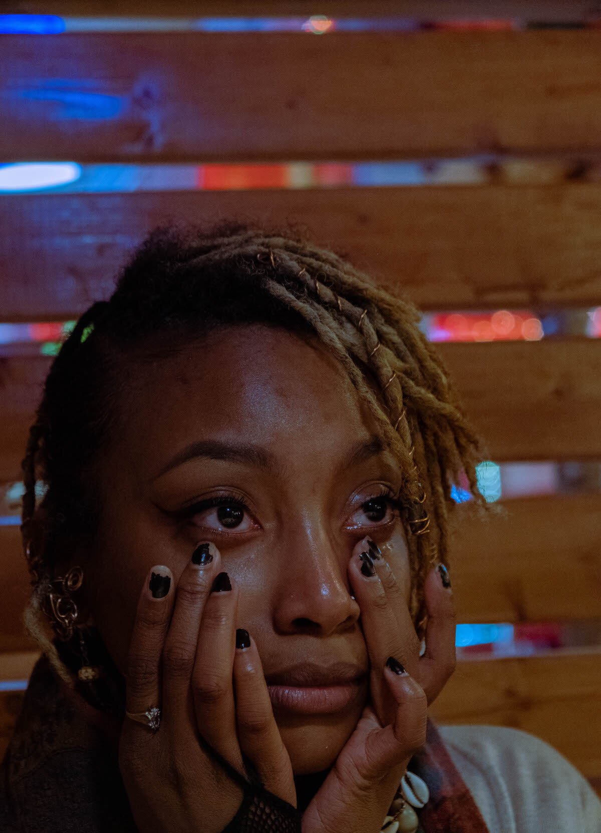 Ikigai, fighting back her tears dabbing them with her fingers that contain a few rings and chipped black fingernail polish, reflecting on “all the threats I’ve received,” which leaves her “[sometimes] scared to speak my truth.”