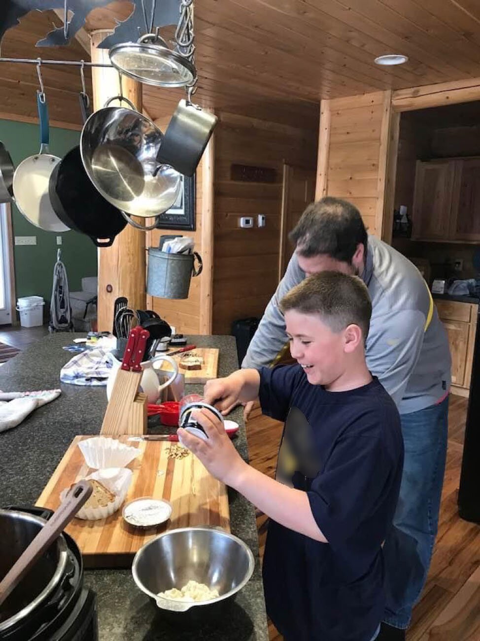 Matt Perkins and his father, Jason Perkins, cooking together. Karen Perkins says their family will often have their own "Chopped" competitions at home based on the popular TV show.