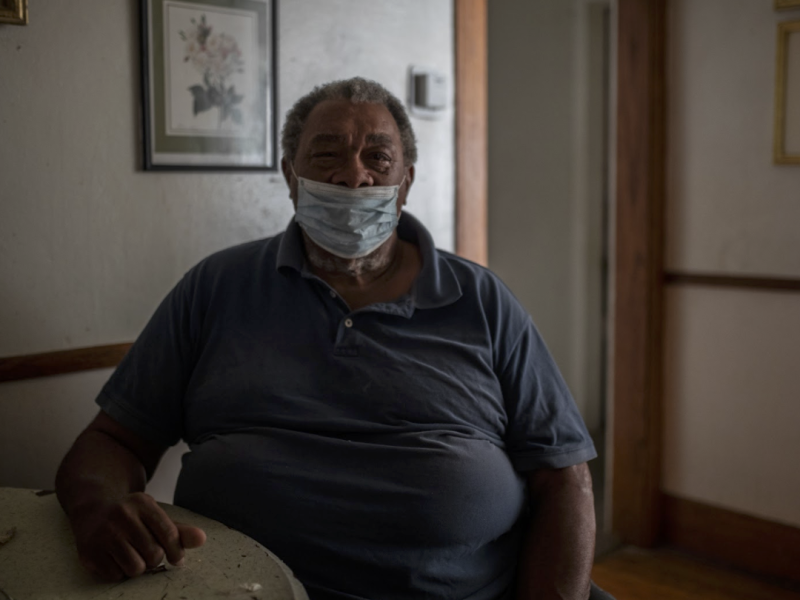James Riley sits at his dining room table inside his home in Flint, Michigan.