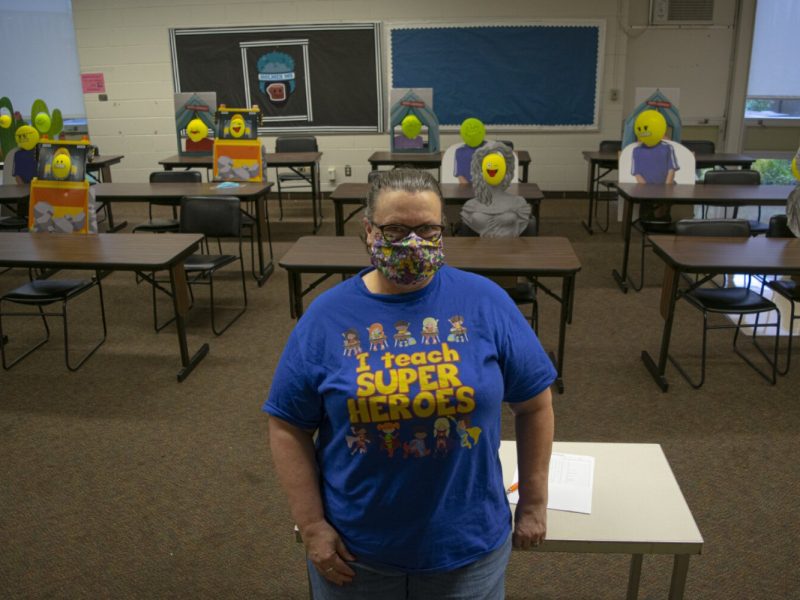 Olayinka sits at the front of her classroom showing off all her newly made 'students'.