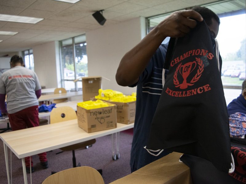 A BHNA volunteer sorts the bags that will soon hold everything from candy to notebooks.