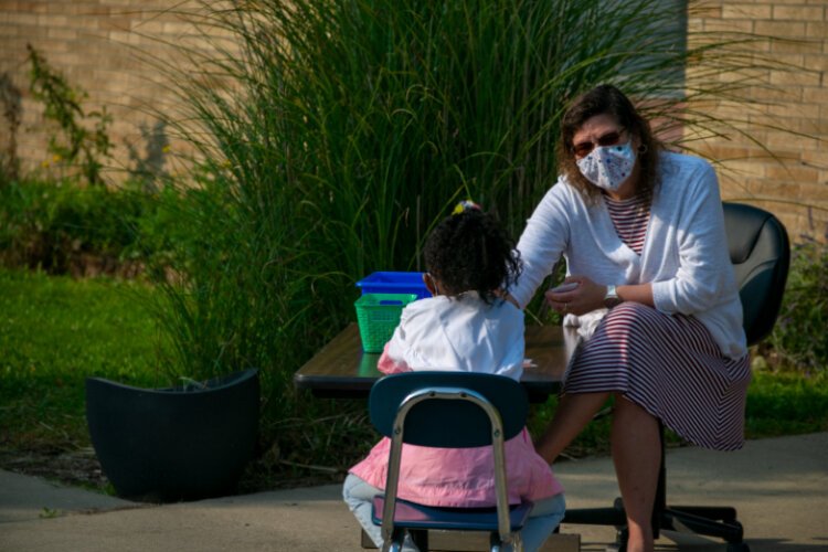 Maher and Janae Felton go over the letters of the alphabet.