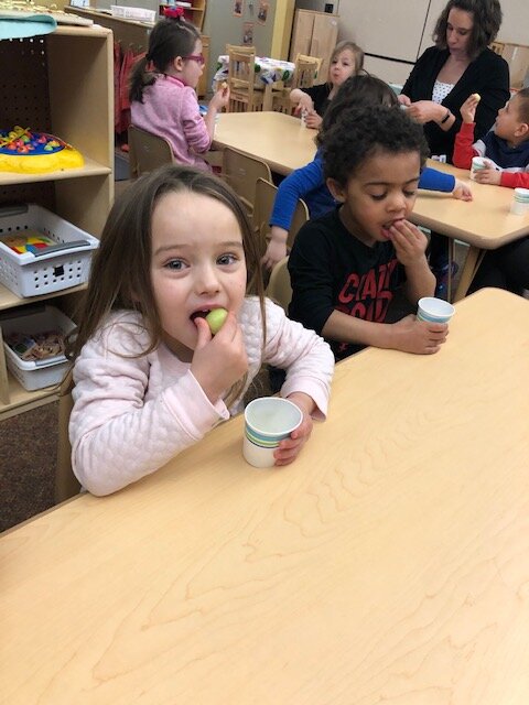 Pre-schoolers in the Grow It, Try It, Like It program enjoy learning about and tasting cantaloupe.