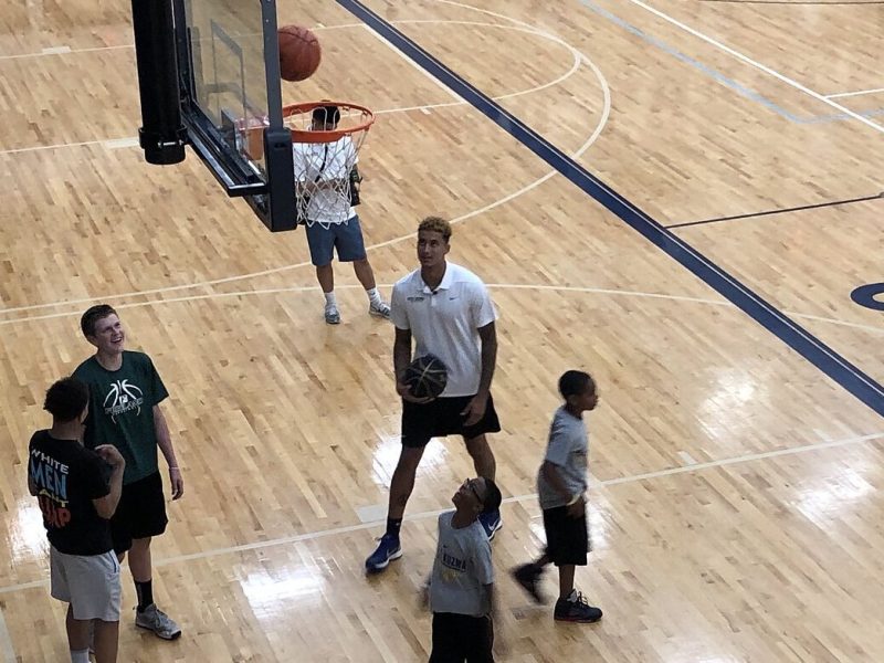 Kyle Kuzma working with young basketball players during his 2019 camp at Powers Catholic High School.
