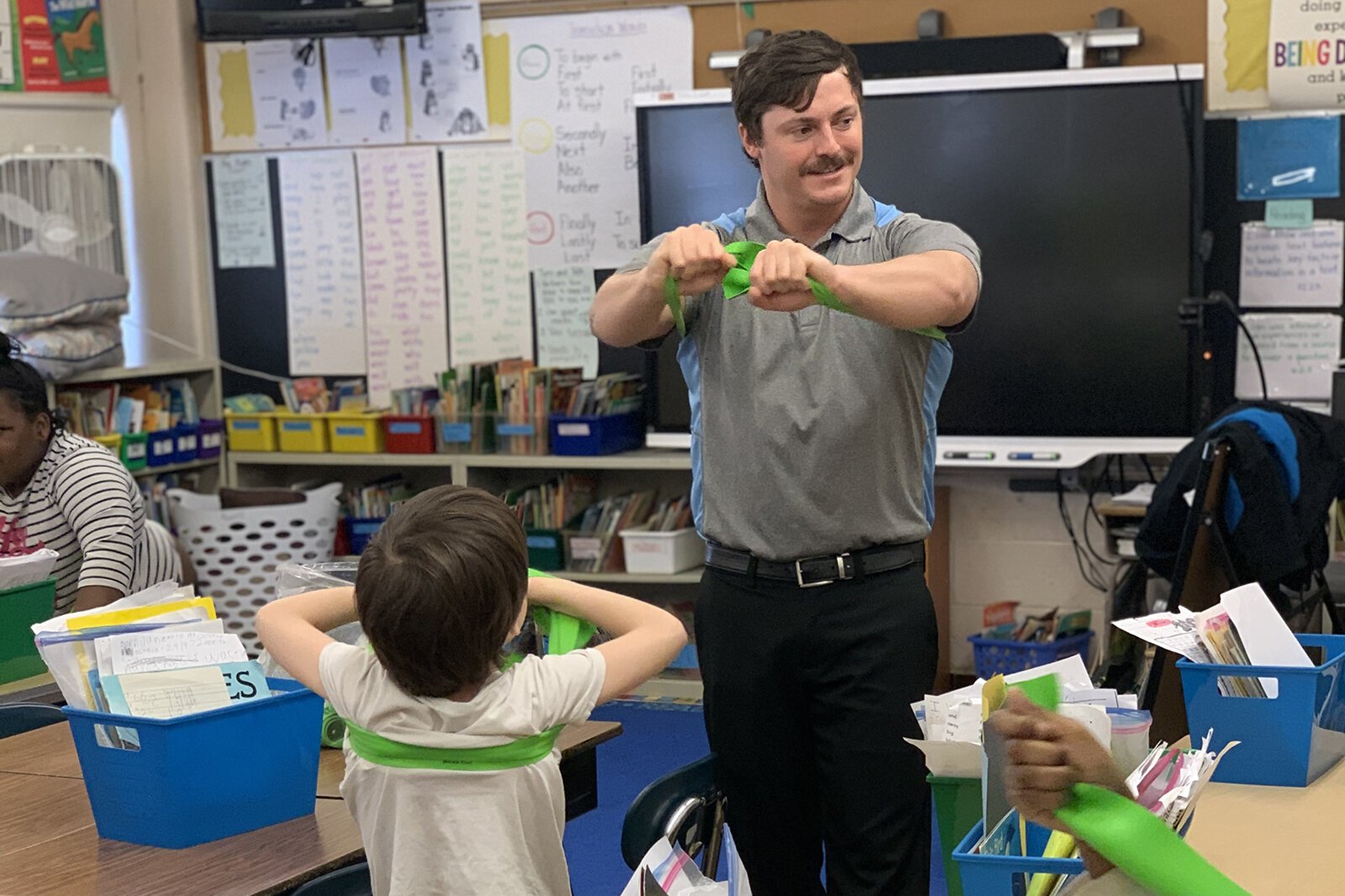 Jared Badour leads a class in strengthening exercises.