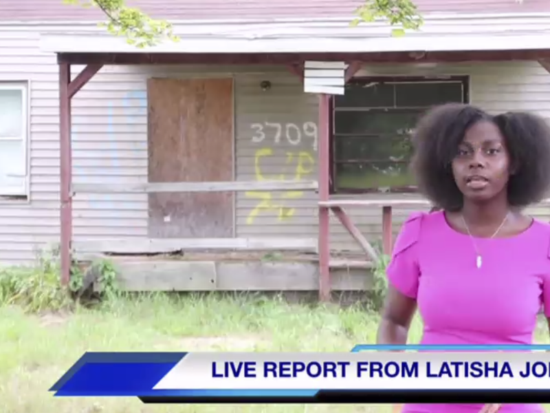 Flint native Latisha Jones standing in front of her childhood home.