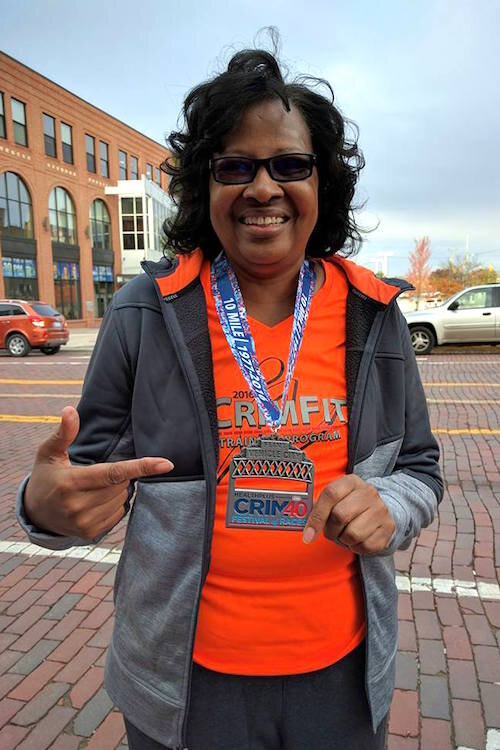 Brenda Brown crosses the 10-mile Crim finish line in November 2016.