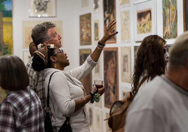 Eureka and Sean McCormick of Flushing study a work by Stefan Davidek at Bucham Gallery in 2017.
