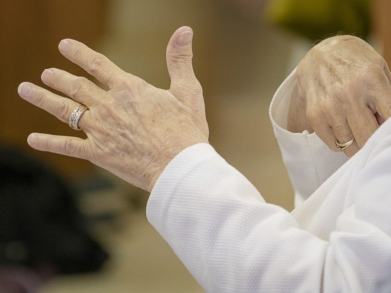 The congregation at Master's House Deaf Church in Flint sings along with their hands during service.