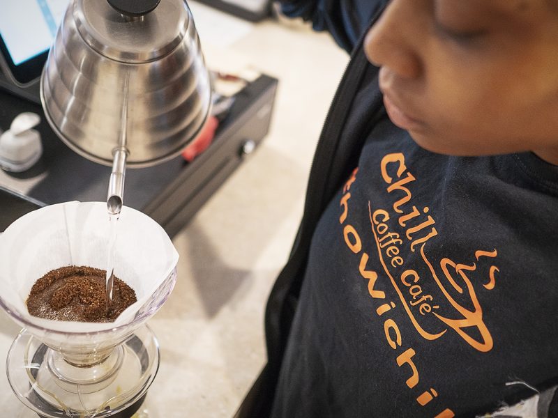 Flint, MI - Friday, June 15, 2018: Barista Cha'Quia Jones, 20, from Flint, prepares a cup of pour over coffee at Chill Coffee Cafe.