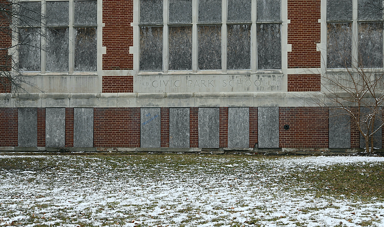 Boarded-up windows in the front of Civic Park Elementary School in Flint, Michigan on March 13, 2023. The school closed its doors in 2010. (Tia Scott | Flintside)