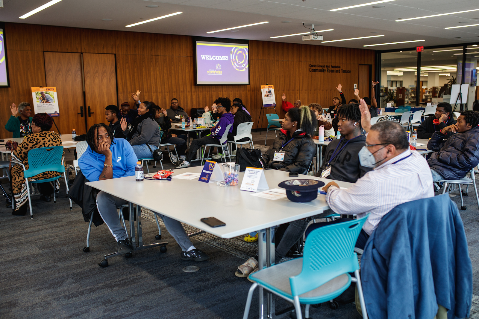 Community members, Southwestern high school students, and Flint Center for Educational Excellence staff were in attendance at the Greater Flint Health Coalition's Stories of Survivors event at the Gloria Coles Flint Public Library on Dec. 8, 2023. (Jenifer Veloso | Flintside.com)