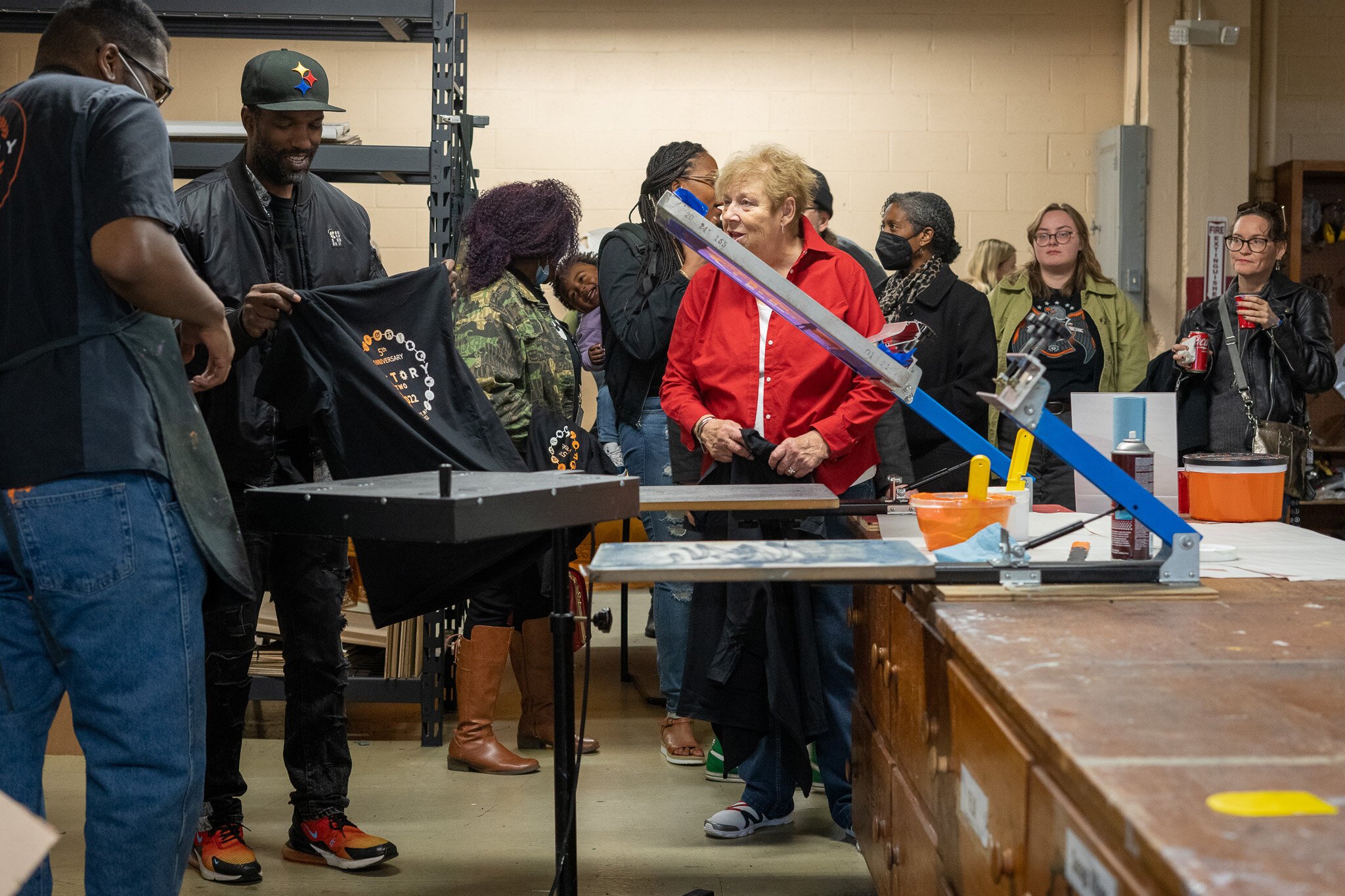 Participants at a previous Factory Two event experience a live screen print demonstration.