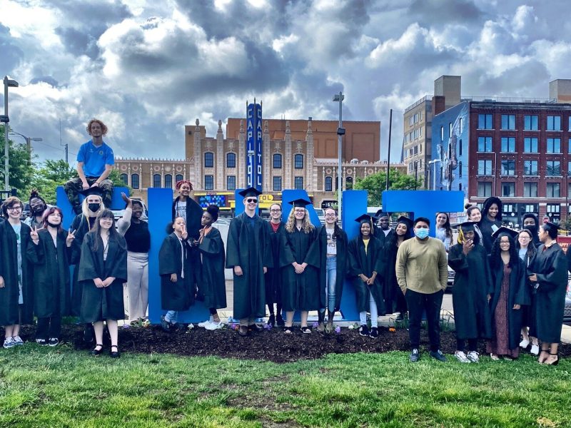 Genesee Early College's class of '22 graduates snap a group photo after their ceremony at The Capitol Theatre in Flint on June 9, 2022.