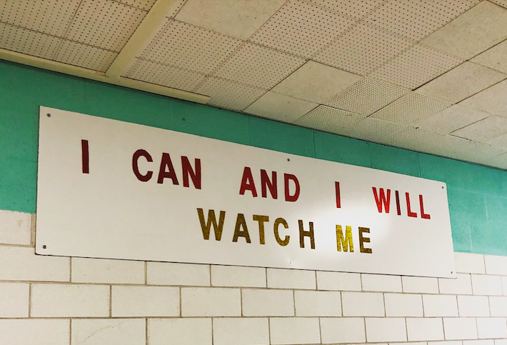 A sign with the message "I can and I will. Watch me" is displayed at Flint Southwestern High School in 2018. (Photo by Annie McMahon Whitlock)