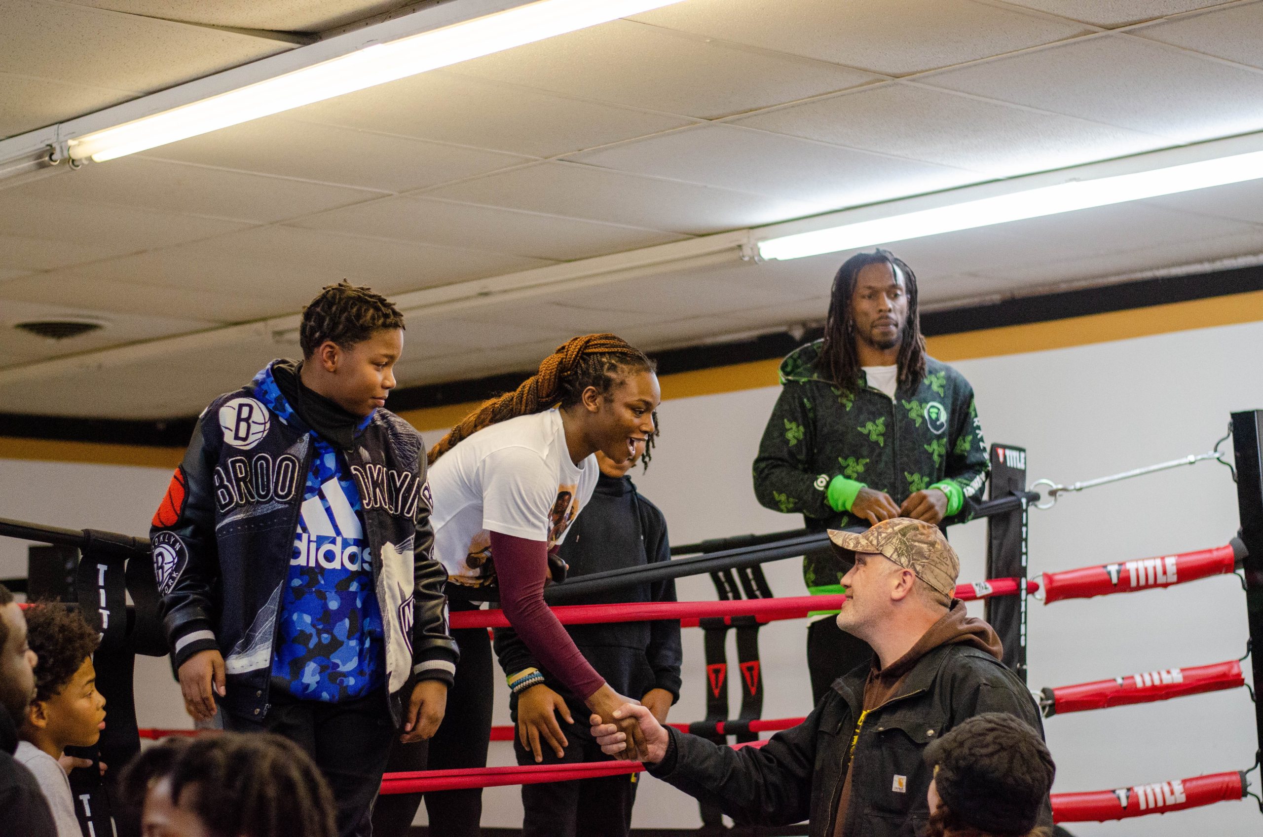 Claressa Shields greets a parent during the free boxing class held on Monday, Jan. 9, 2023. (Rayford Gray | Flintside)